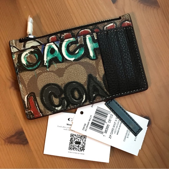 Signature coated canvas and refined pebble leather Five credit card slots Zip po - Picture 7 of 11